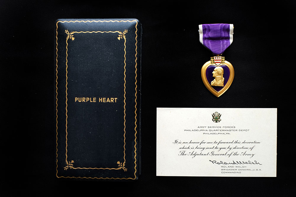 Purple heart medal with accessories awarded to Pfc. Charles Kogan